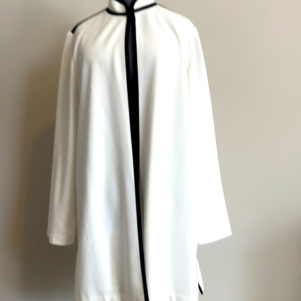 New but no tags. Chico beautiful cream with black trim topper jacket. M size